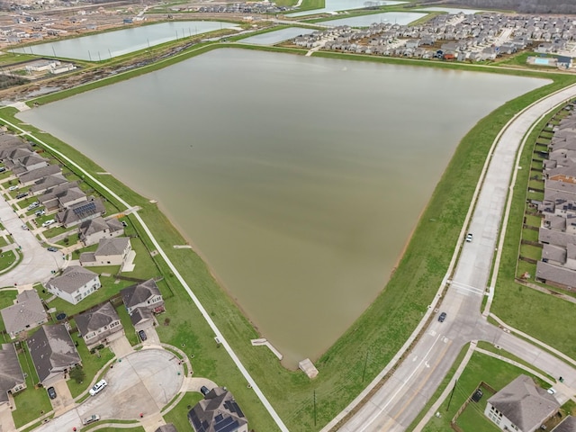 bird's eye view with a water view and a residential view