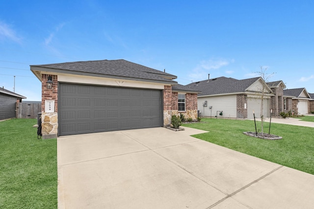 ranch-style home with a garage, driveway, and a front yard