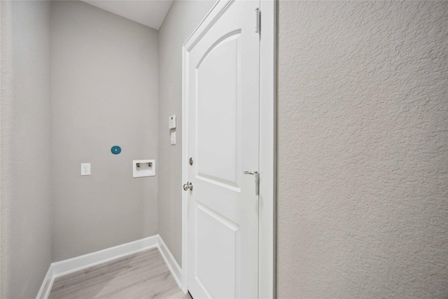 entryway with light wood-style floors and baseboards