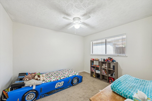 bedroom with light carpet, a textured ceiling, and a ceiling fan