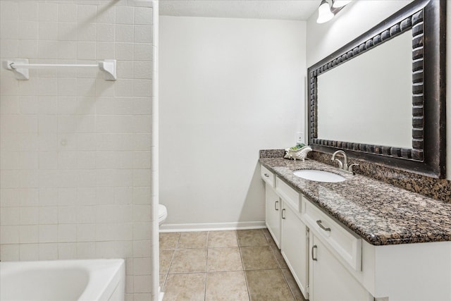 full bathroom with tile patterned flooring, baseboards, vanity, and toilet