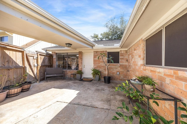 view of patio / terrace featuring fence