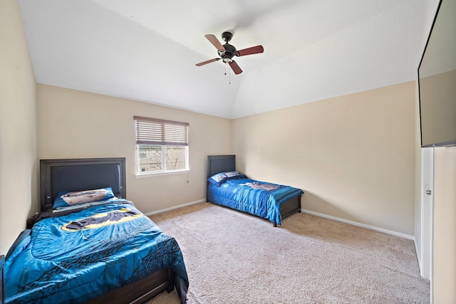 bedroom featuring lofted ceiling, light carpet, a ceiling fan, and baseboards