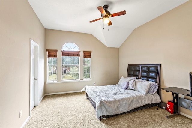 bedroom with lofted ceiling, carpet, and baseboards