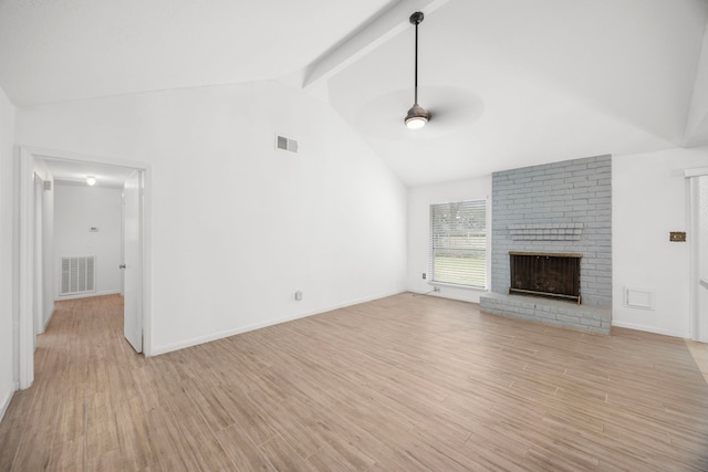 814 Pickford Dr, Katy, TX 77450 - unfurnished living room featuring a ceiling fan, a brick fireplace, beamed ceiling, light wood-type flooring, and high vaulted ceiling