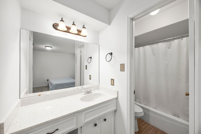 814 Pickford Dr, Katy, TX 77450 - ensuite bathroom with vanity, shower / bathtub combination with curtain, and wood finished floors