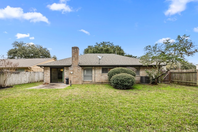 814 Pickford Dr, Katy, TX 77450 - back of house featuring a fenced backyard, a chimney, a patio, brick siding, and roof with shingles