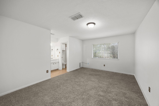814 Pickford Dr, Katy, TX 77450 - spare room with light carpet and a textured ceiling