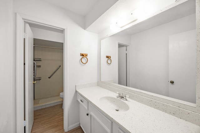 814 Pickford Dr, Katy, TX 77450 - bathroom with vanity, a walk in shower, and wood finished floors
