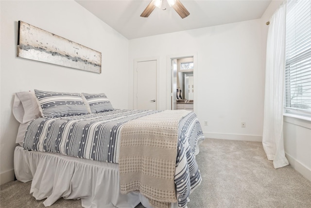 bedroom with a ceiling fan, carpet, and baseboards