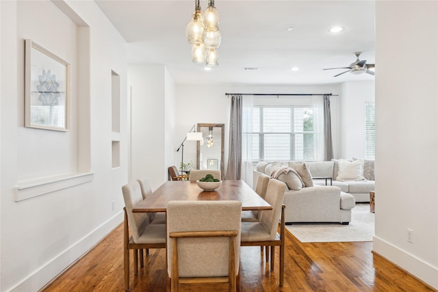 dining area with recessed lighting, wood finished floors, and baseboards