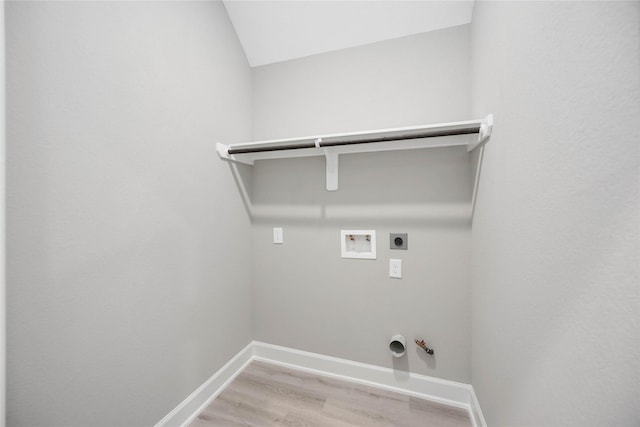 washroom featuring washer hookup, gas dryer hookup, electric dryer hookup, laundry area, and baseboards