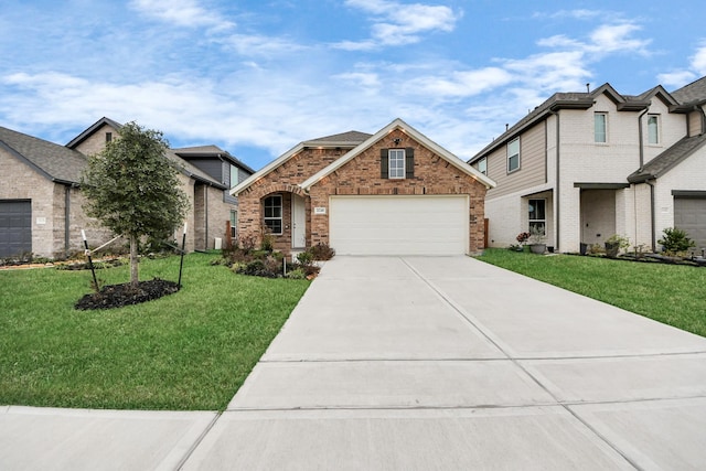 view of front facade with driveway, a garage, a front lawn, and brick siding