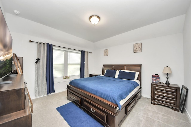 bedroom featuring light carpet