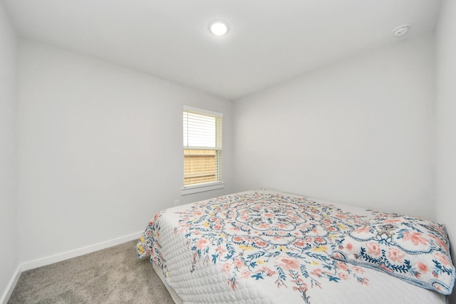 carpeted bedroom with baseboards