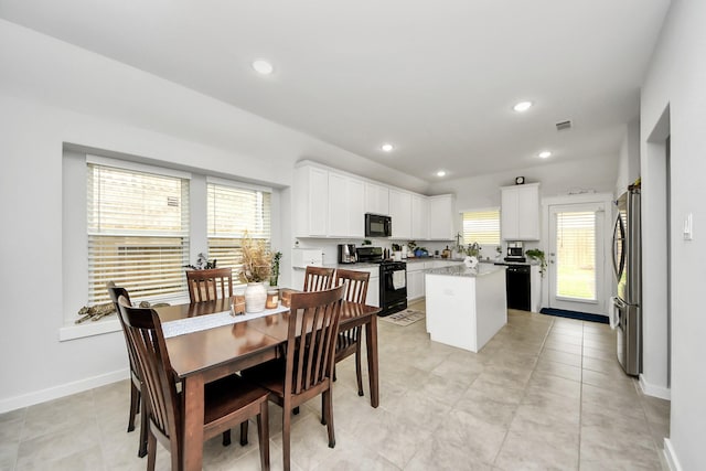 dining room featuring light tile patterned floors, visible vents, baseboards, and recessed lighting