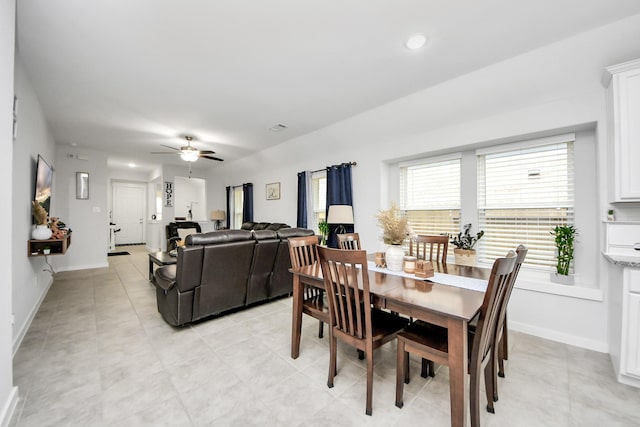 dining area featuring ceiling fan, recessed lighting, light tile patterned flooring, and baseboards