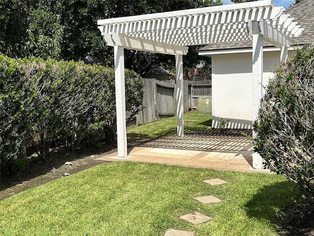 view of yard featuring fence and a pergola