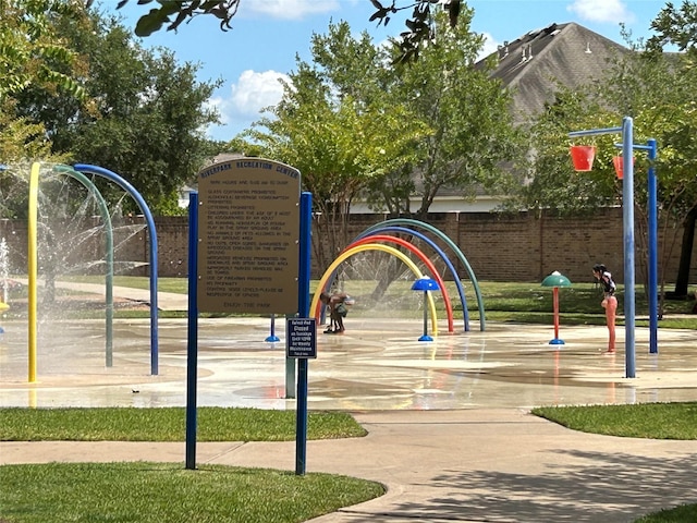 view of community featuring fence