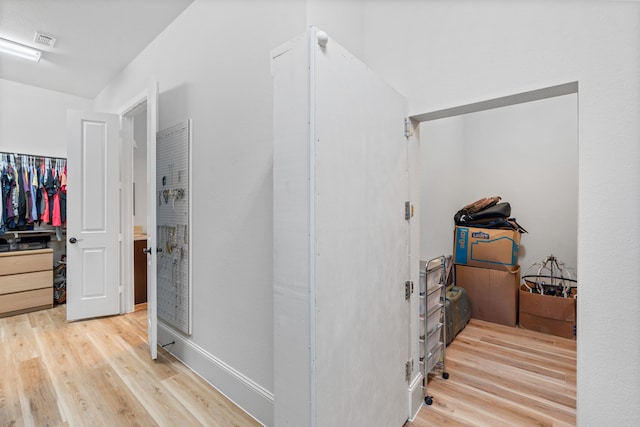 interior space with visible vents and wood finished floors