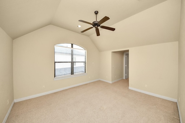2256 Lake Cove Way, Seabrook, TX 77586 - empty room featuring light colored carpet, vaulted ceiling, a ceiling fan, and baseboards