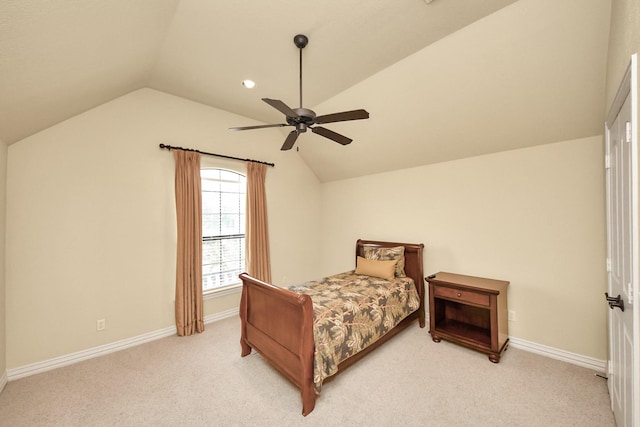 bedroom with lofted ceiling, carpet, and baseboards