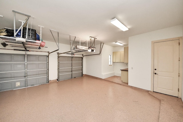 garage featuring a garage door opener