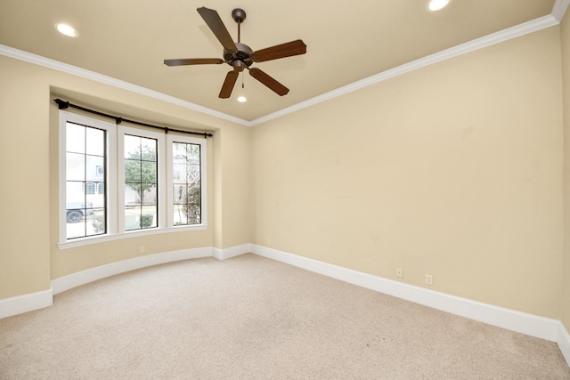 unfurnished room featuring carpet floors, crown molding, and baseboards