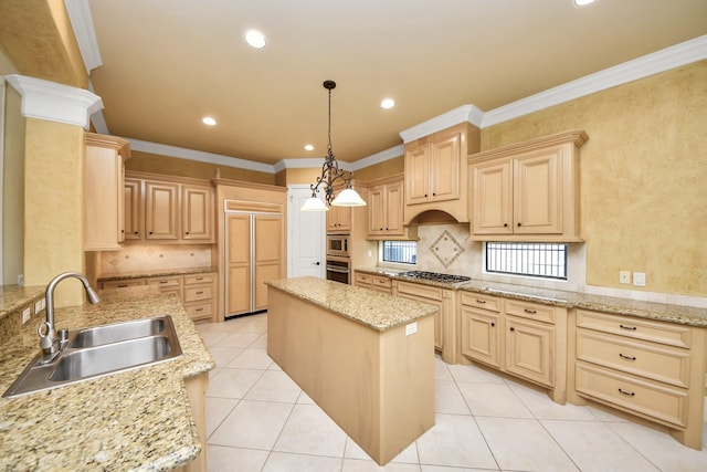 kitchen featuring hanging light fixtures, a sink, light stone countertops, and a center island