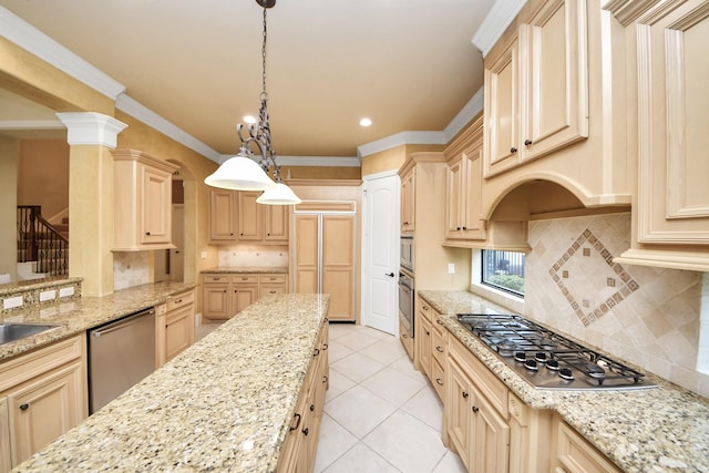 kitchen featuring stainless steel appliances, light stone counters, light brown cabinets, and pendant lighting