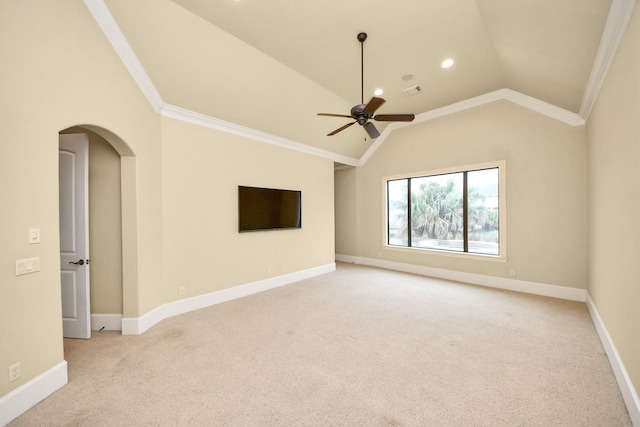 empty room with arched walkways, light carpet, lofted ceiling, and baseboards