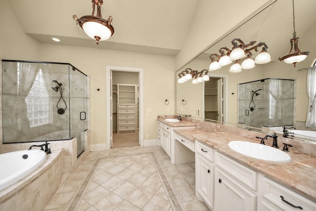 bathroom featuring a shower stall, baseboards, a walk in closet, and a sink