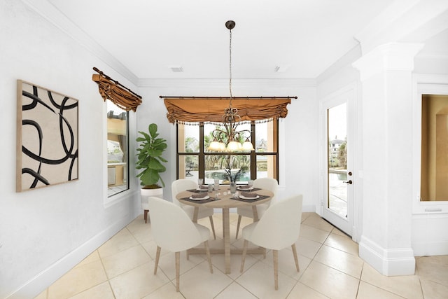 2256 Lake Cove Way, Seabrook, TX 77586 - dining area featuring a chandelier, light tile patterned flooring, decorative columns, ornamental molding, and baseboards