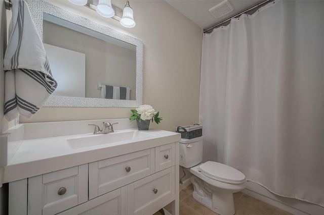 bathroom with vanity, a shower with shower curtain, visible vents, tile patterned floors, and toilet