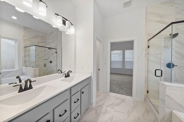 full bathroom featuring marble finish floor, visible vents, a sink, and a marble finish shower