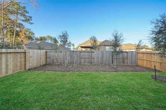 view of yard featuring a fenced backyard