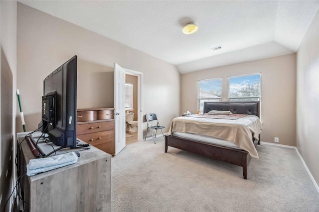 bedroom with lofted ceiling, visible vents, light carpet, and baseboards