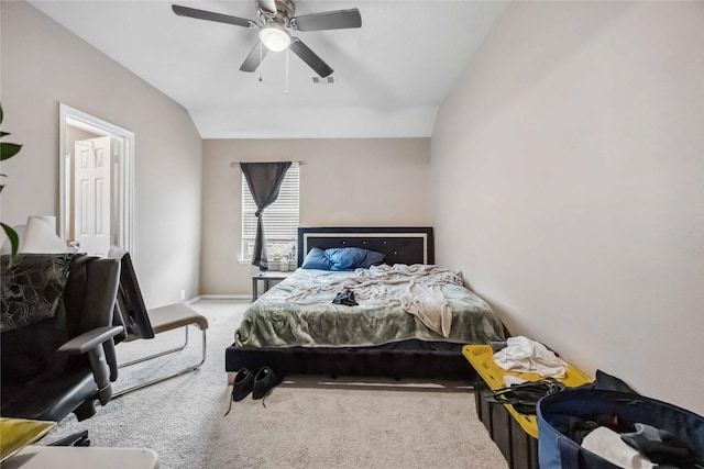 bedroom with a ceiling fan, lofted ceiling, light carpet, and visible vents