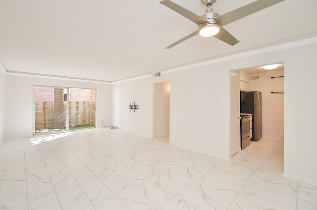 spare room featuring marble finish floor, visible vents, ornamental molding, and baseboards