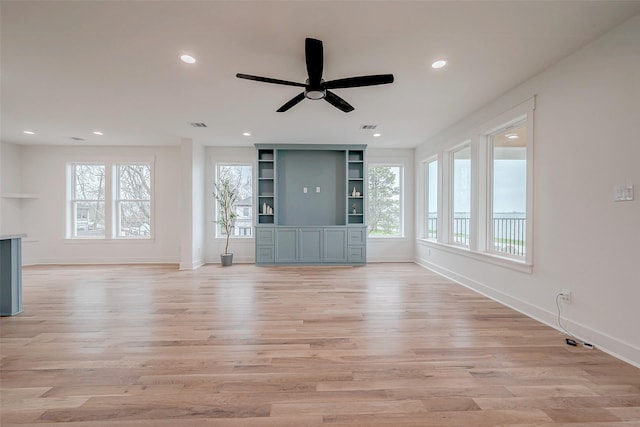 unfurnished living room featuring light wood-style floors, recessed lighting, and baseboards