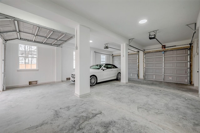 garage featuring baseboards and a garage door opener