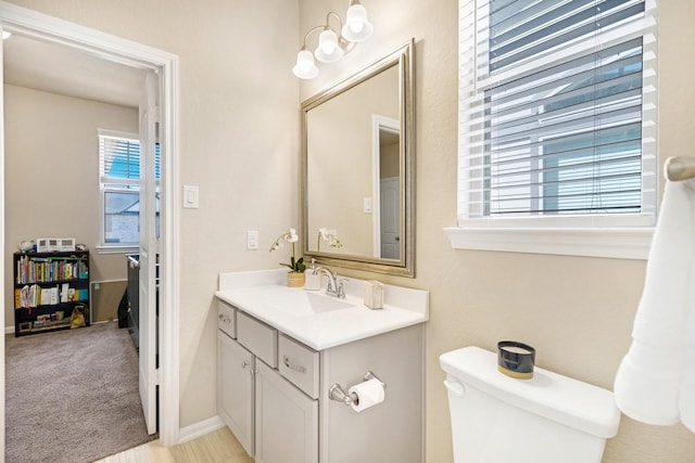 bathroom with toilet and vanity