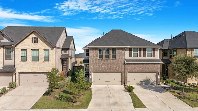 view of front of home featuring brick siding, roof with shingles, concrete driveway, a garage, and a residential view