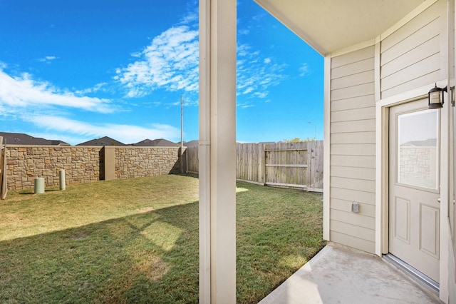 view of yard with a fenced backyard