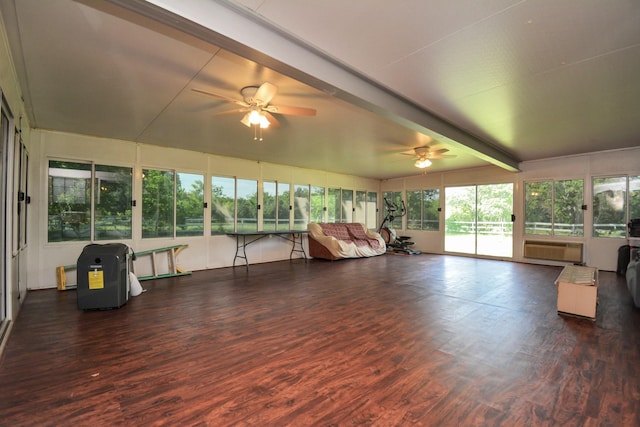 sunroom / solarium featuring a ceiling fan, an AC wall unit, and beamed ceiling