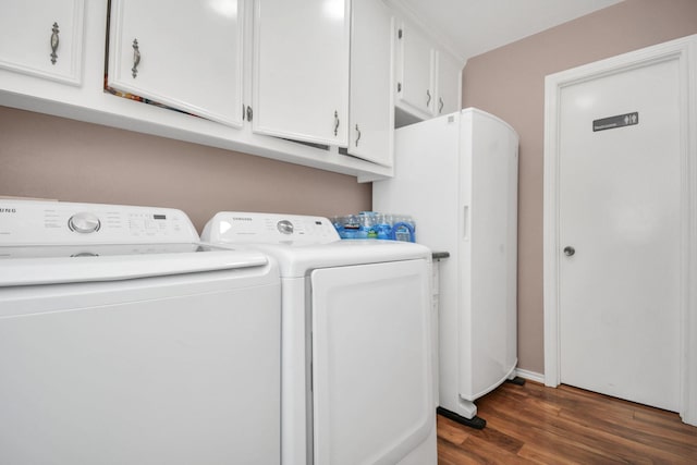 laundry room with washing machine and dryer and dark wood finished floors