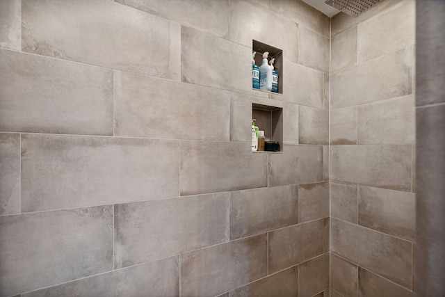 room details with a tile shower