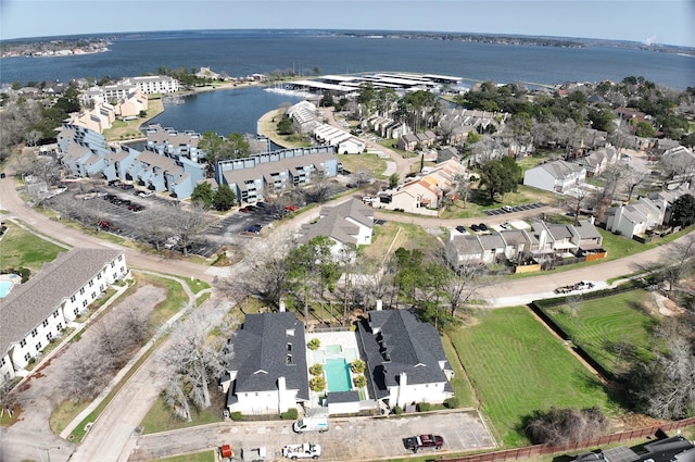 aerial view with a water view and a residential view