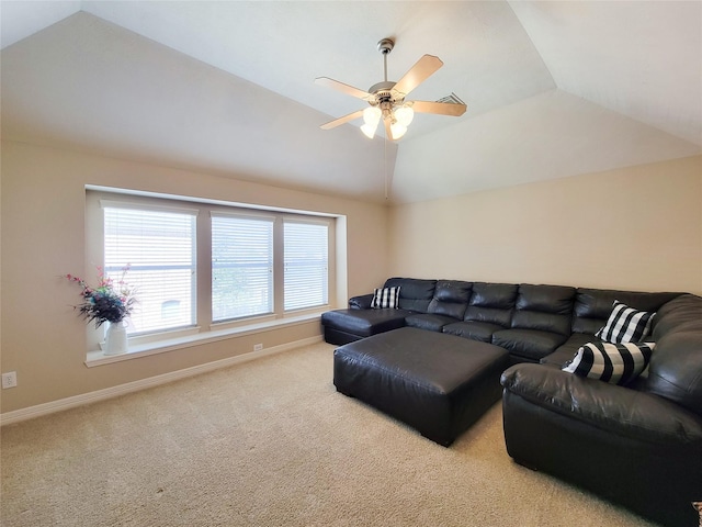 carpeted living room featuring a ceiling fan, vaulted ceiling, and baseboards