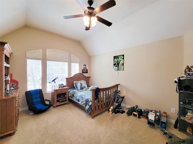 carpeted bedroom featuring a ceiling fan, vaulted ceiling, and baseboards